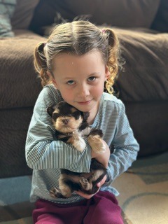 a puppy and a kid